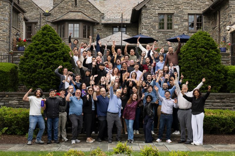 The ASA School 2026 group, cheering on the steps of a stone house in Philadelphia